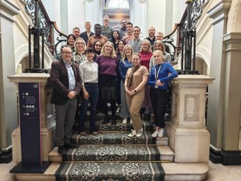 Participants at the Institute of Medicine AI workshop gather for a group photo at No.6 Kildare street